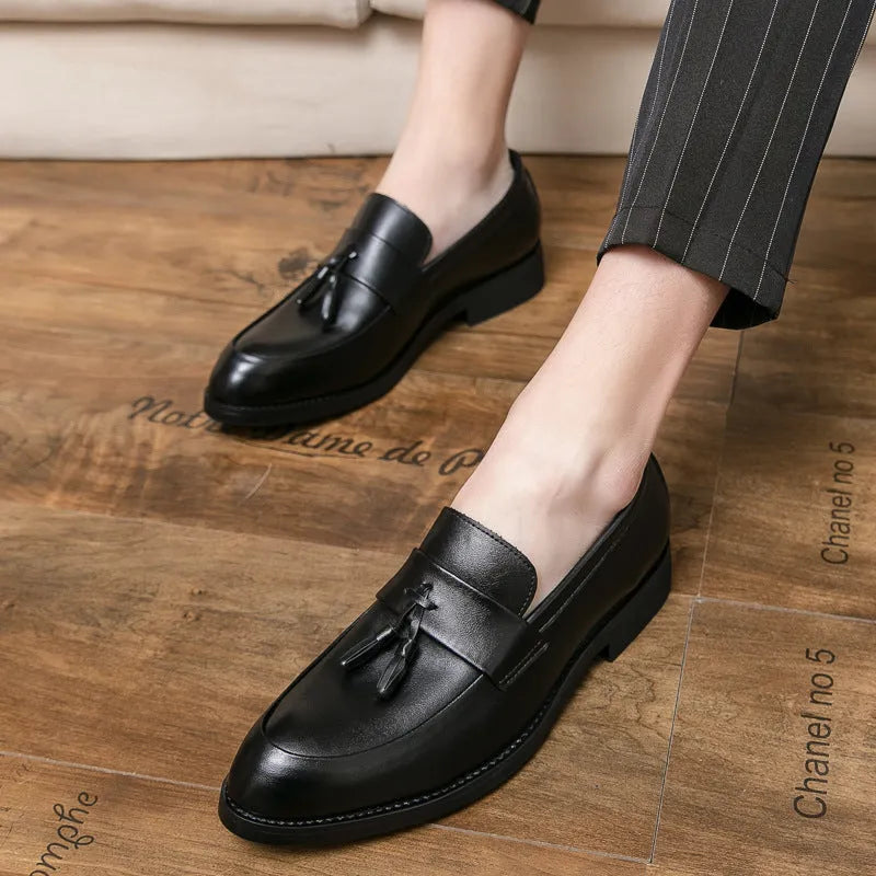 Men's black slip-on business casual leather shoes with tassel detail and rubber sole