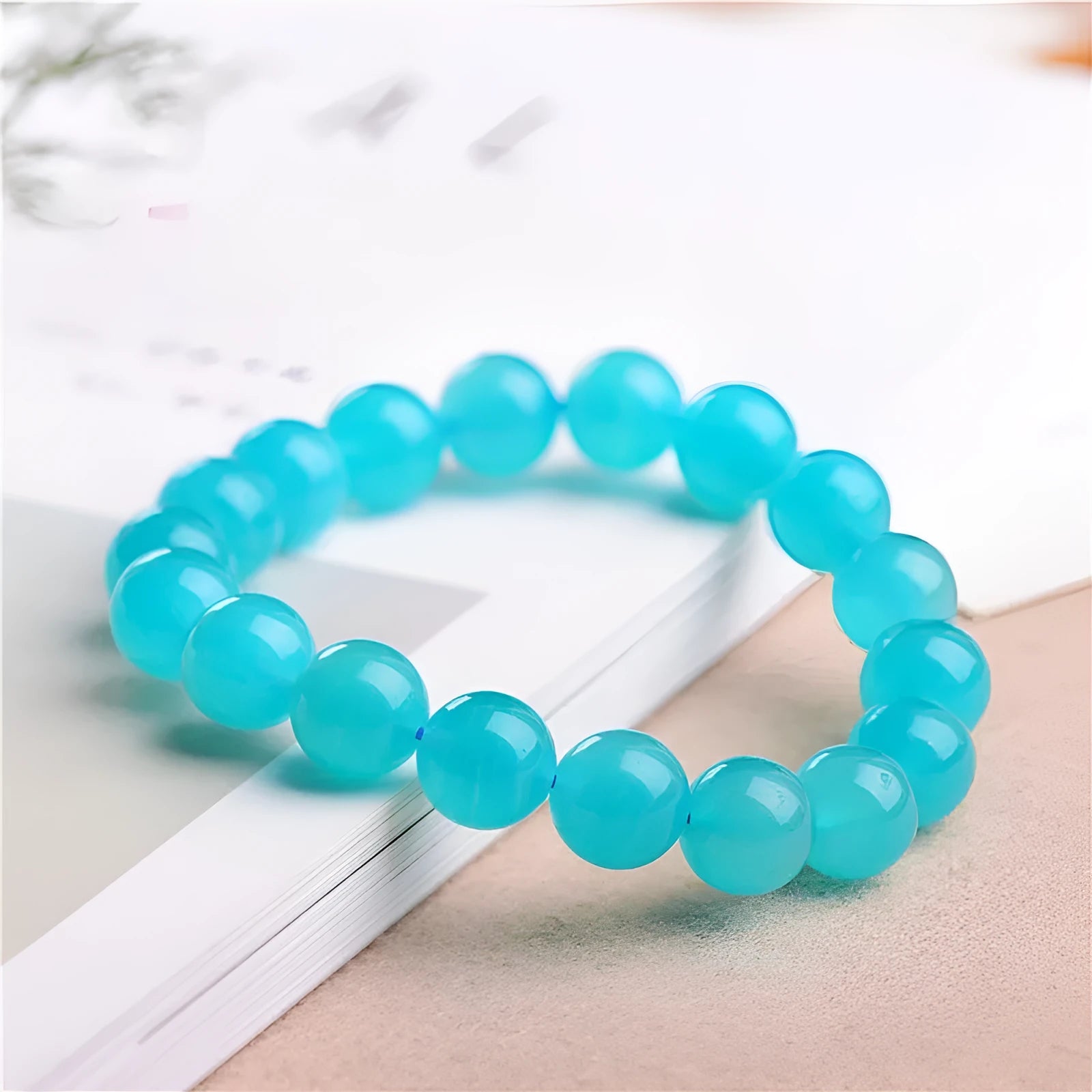 Grade 7A Amazonite natural stone scattered beads arranged on a bracelet, showing blue-green colour and polished finish.