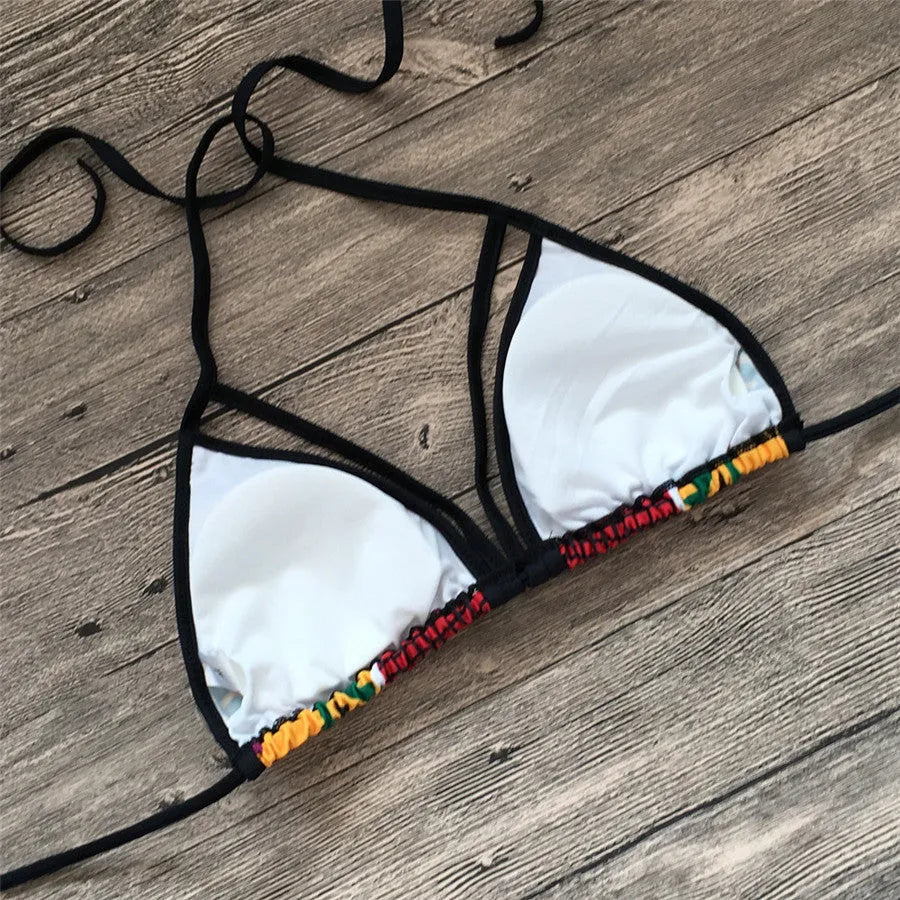 Women's high-waist bikini swimsuit with digital printing and backless design on a mannequin.