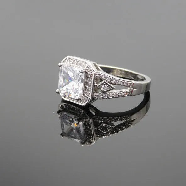 Women's geometric zircon ring with hollow design and quadrilateral shape in platinum colour.