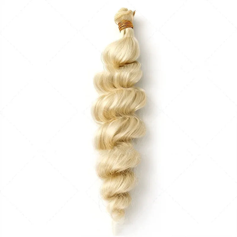 Golden synthetic wig on a stand showing long, straight high-temperature chemical fibre weft.