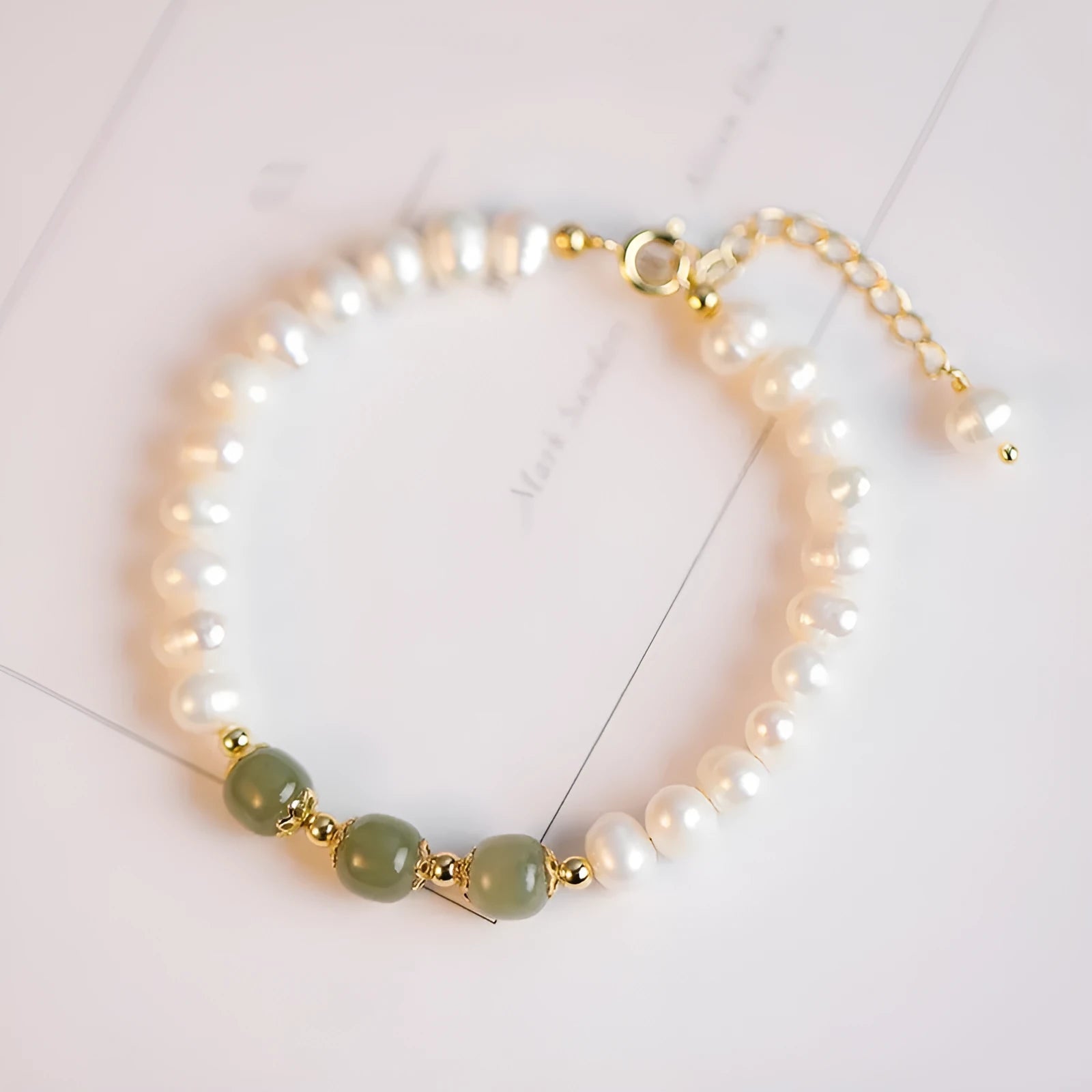 Freshwater pearl bracelet with diamond-shaped charm in electroplated Hetian jade colour