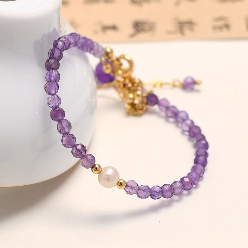 Chinese style women's crystal bracelet with diamond-shaped beads in amethyst colour