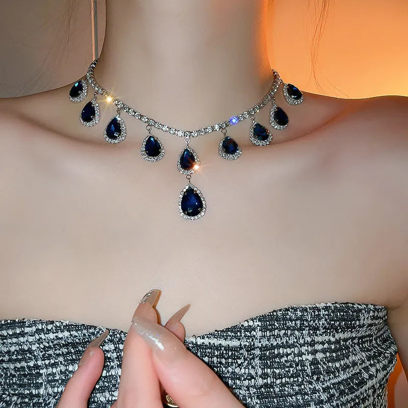 Silver needle water drop earrings and necklace set in blue with zircon pendants and diamond treatment