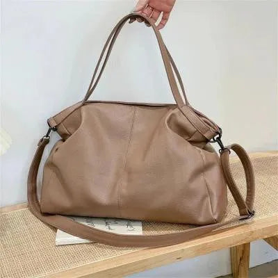 Large soft surface PU messenger bag in a horizontal square tote style with a shoulder strap.