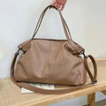 Large soft surface PU messenger bag in a horizontal square tote style with a shoulder strap.