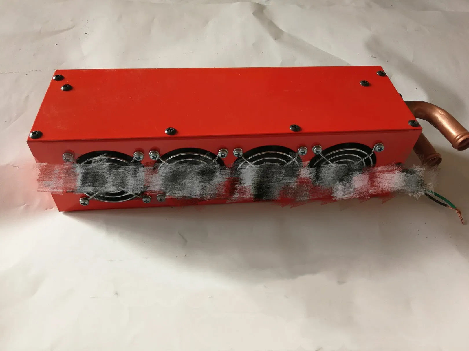 Metal car heater with four small copper pipes and two connection joints for 12V 24V vehicle heating.