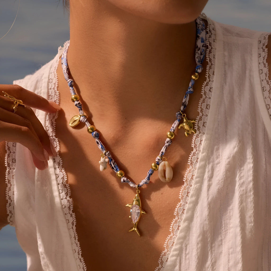Gold starfish shell pendant on hand-knotted rope chain, 18K plated stainless steel, geometric shape