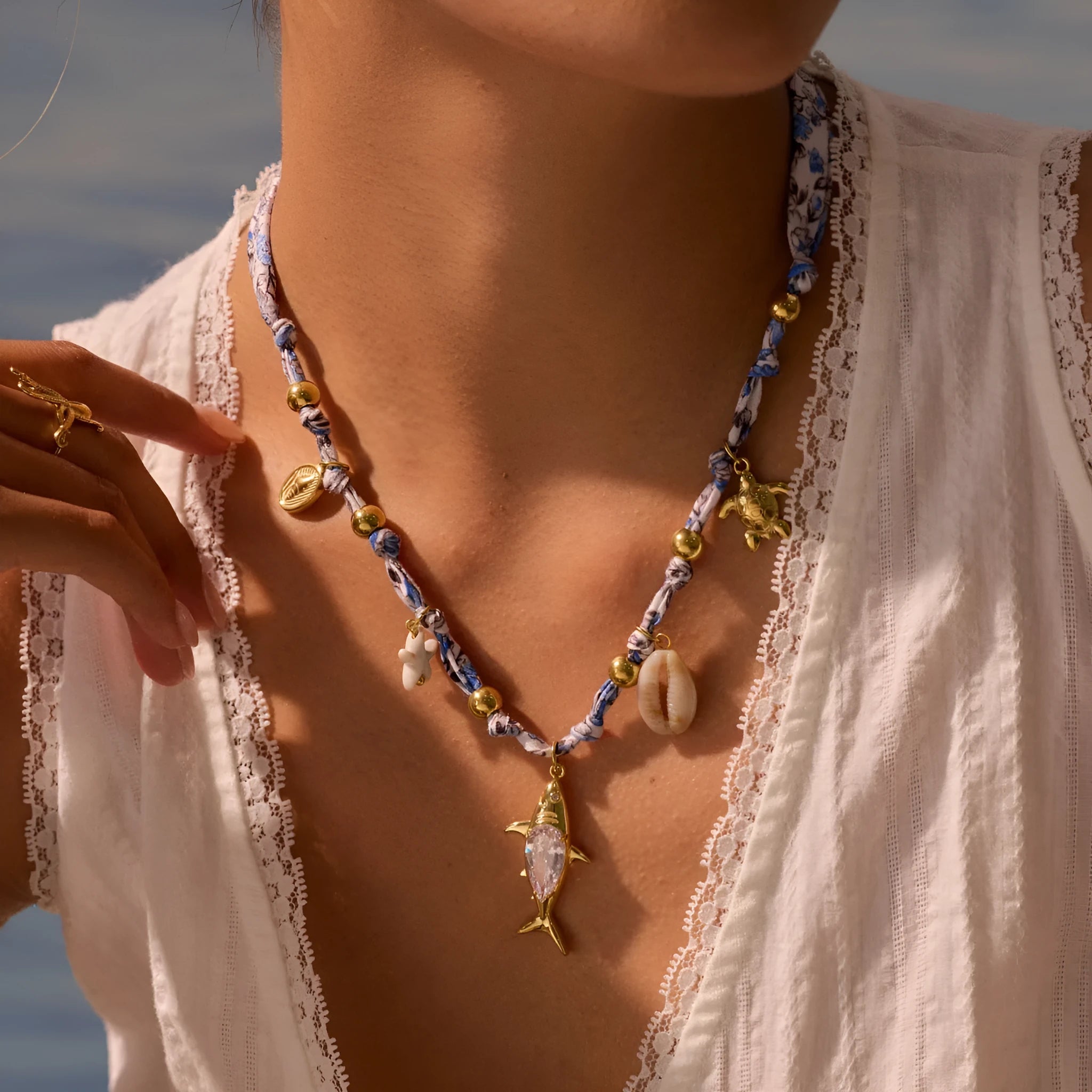 Gold starfish shell pendant on hand-knotted rope chain, 18K plated stainless steel, geometric shape