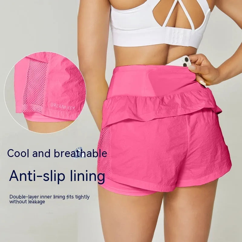 Women's loose cotton blend quick-drying sports shorts in lemon yellow on a mannequin
