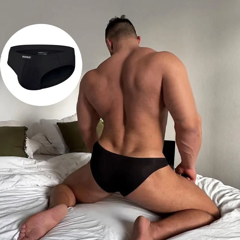 Men's seamless low-waist briefs in black, made from breathable polyester knit fabric.