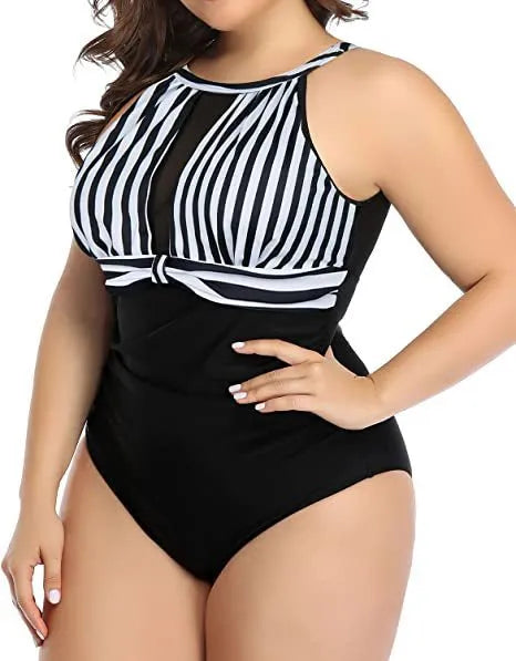 Women's black one-piece swimsuit with lace trim on a mannequin.