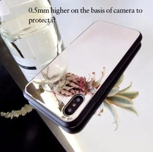 Black iPhone mirror phone case showing reflective back surface, compatible with multiple iPhone models.