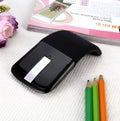 Folded Bluetooth wireless mouse showing compact 131.2mm length with touch-sensitive surface