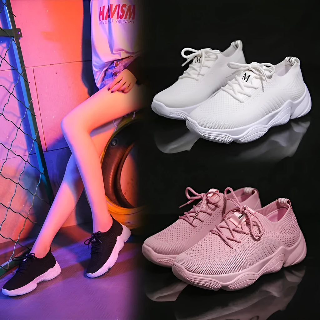 Women's white casual sports shoes with woven upper, thick rubber sole, and front strap fastening