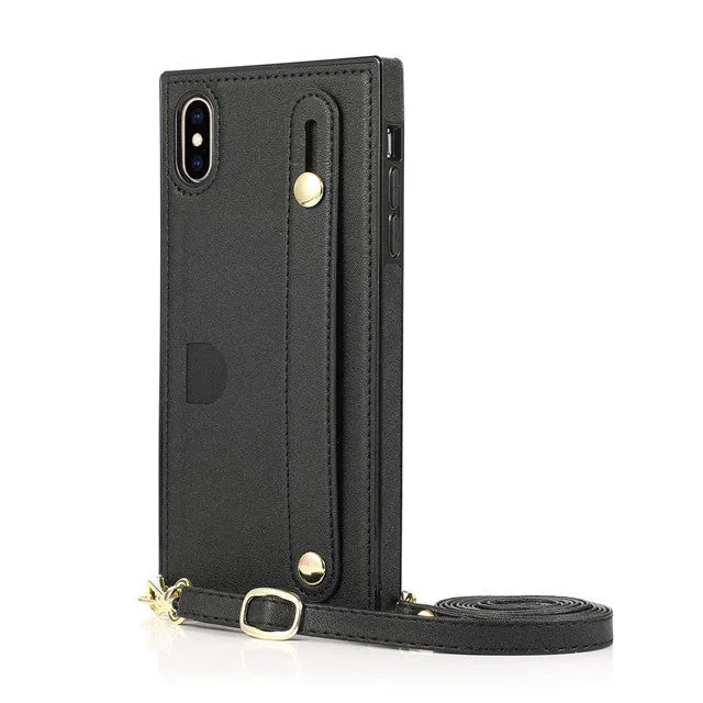 Leather iPhone case with card slots on the back and an attached black wrist strap.