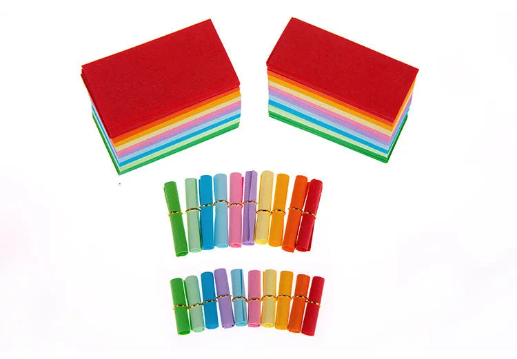 Assorted coloured mini paper scrolls for drift bottle messages with metal eyelets, shown in different sizes.