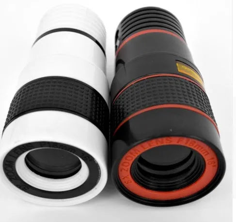 12X magnification phone telescope lens with mounting clip and cleaning cloth on a table.