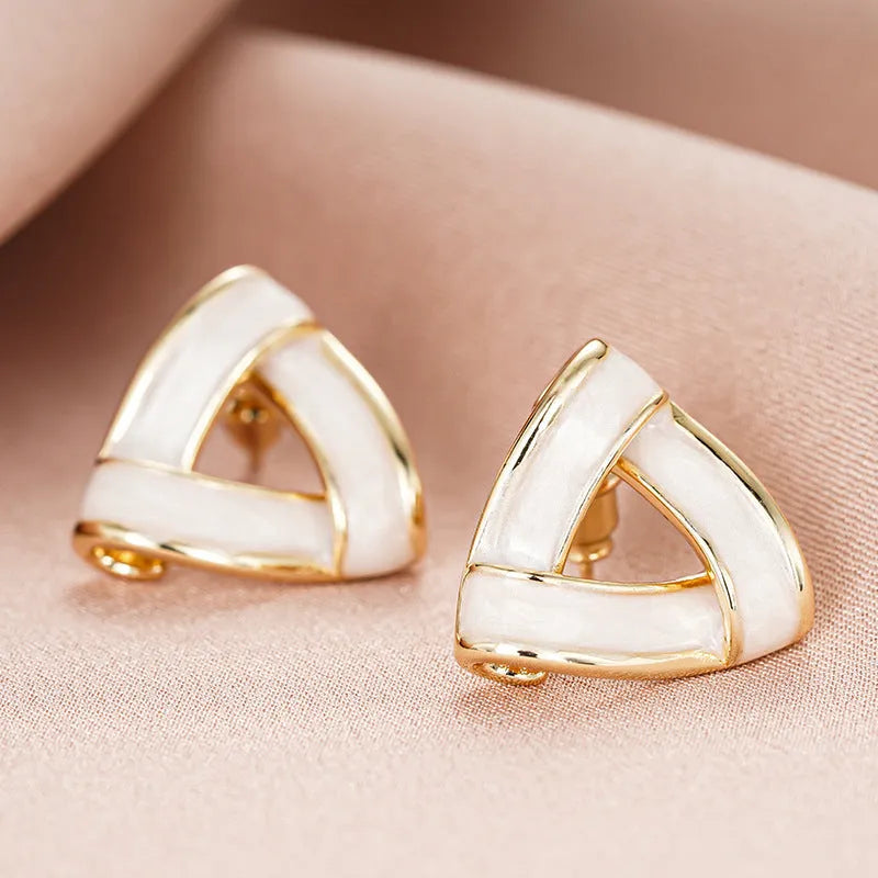 Women's metal oil stud earrings in yellow gold with inlaid zircon and triangle shape