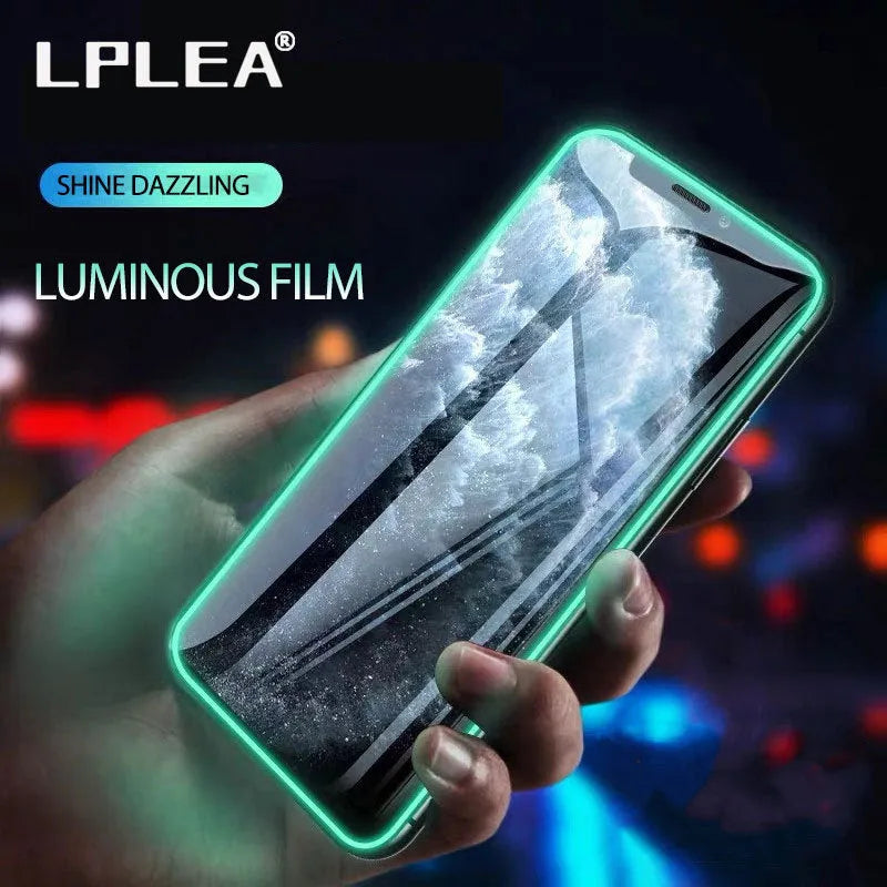 Luminous tempered glass screen protector for iPhone glowing softly in a dark setting.