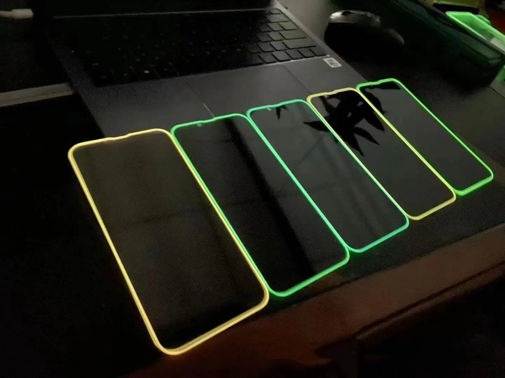 Fluorescent glowing tempered glass screen protector for iPhone on a dark background.