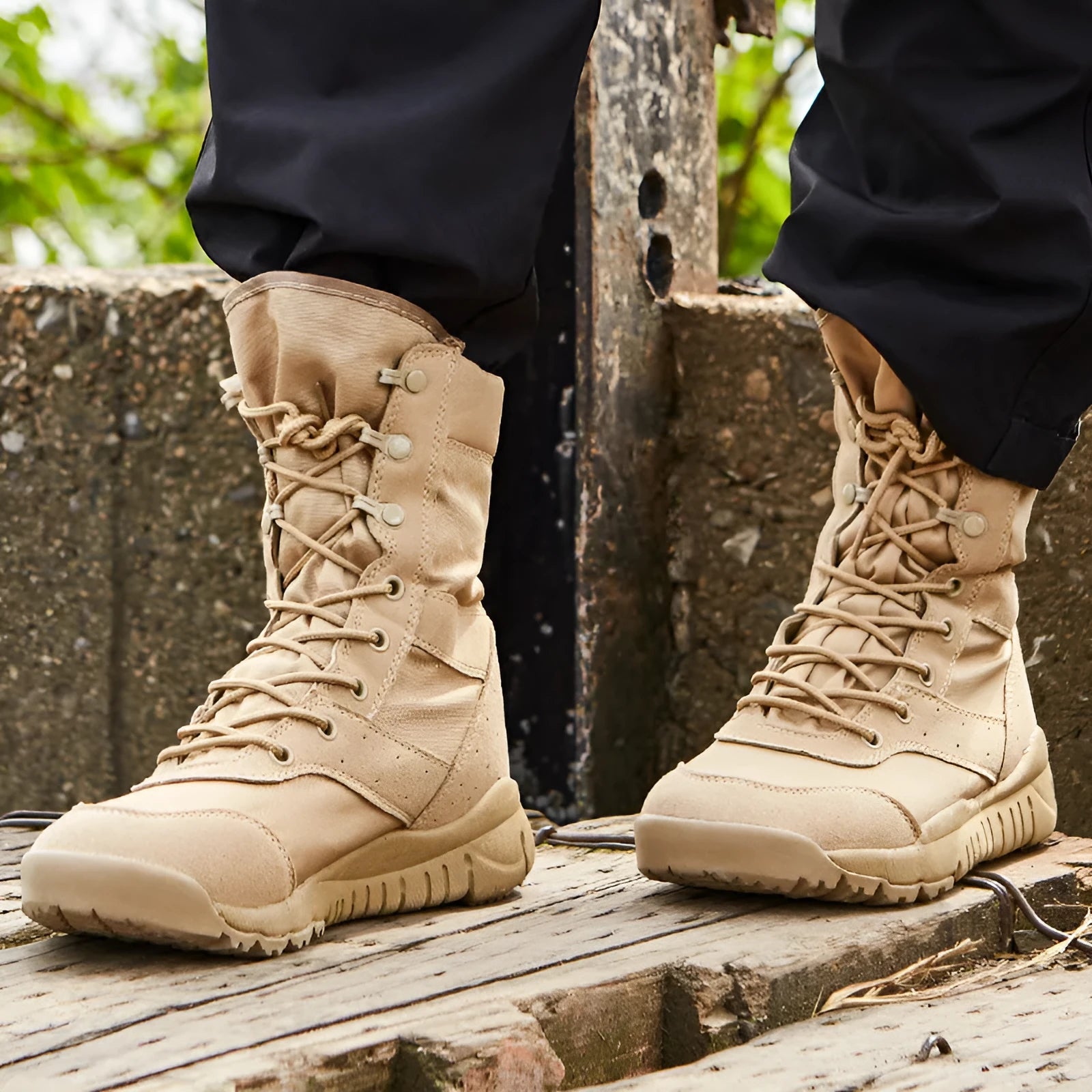 Black and sand coloured Yulong tactical desert combat boots for outdoor climbing and sports.
