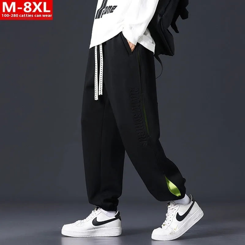 Men's black banded ankle cotton trousers with stitching detail and loose fit design