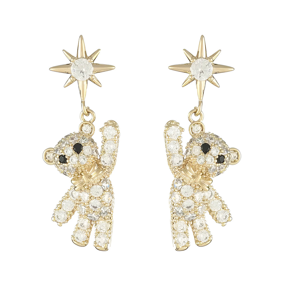 Star-shaped stud earrings in gold with diamond-cut metal and inlaid artificial stones