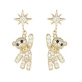 Star-shaped stud earrings in gold with diamond-cut metal and inlaid artificial stones