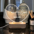 Personalised acrylic LED night light showing custom names and dates with transparent 20x11.5cm design