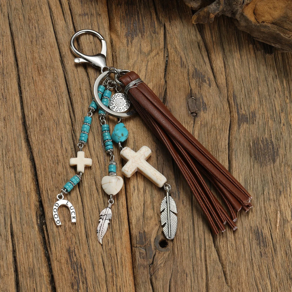 Cross alloy leather tassel pendant keychain in retro style, colour XY-3669, on a neutral background