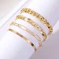 Set of four gold electroplated alloy bracelets on a surface