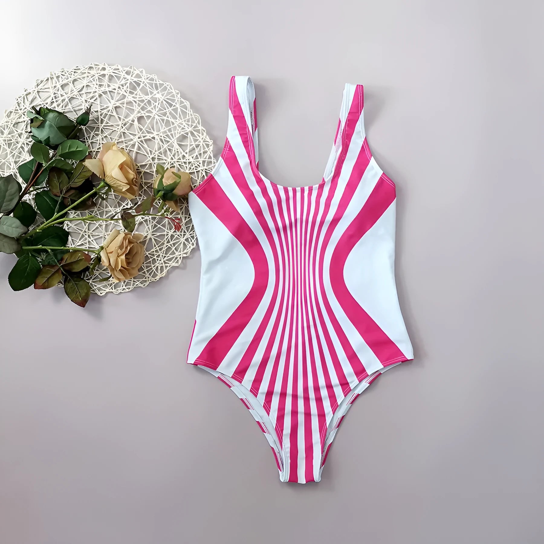 Women's pink striped one-piece swimsuit showing front and rear digital print design.