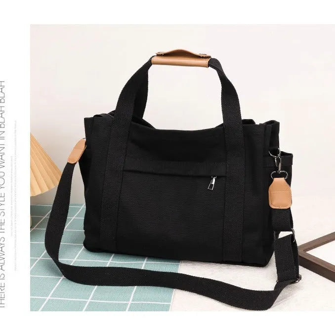 Large canvas tote bag with multiple internal compartments in horizontal square design