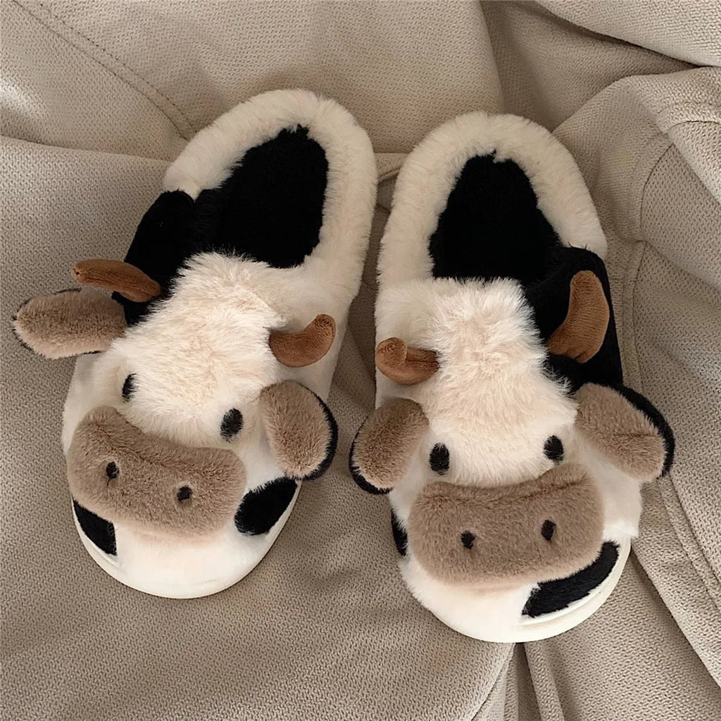 White cow pattern slippers with faux fur upper and textured non-slip soles