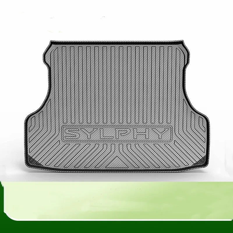 Black car boot liner with carbon fibre pattern texture, laid flat showing its tailored shape.