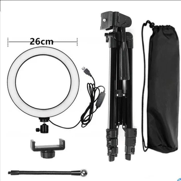 Silver adjustable tripod phone stand extended to mid-height with a ring light attachment point.