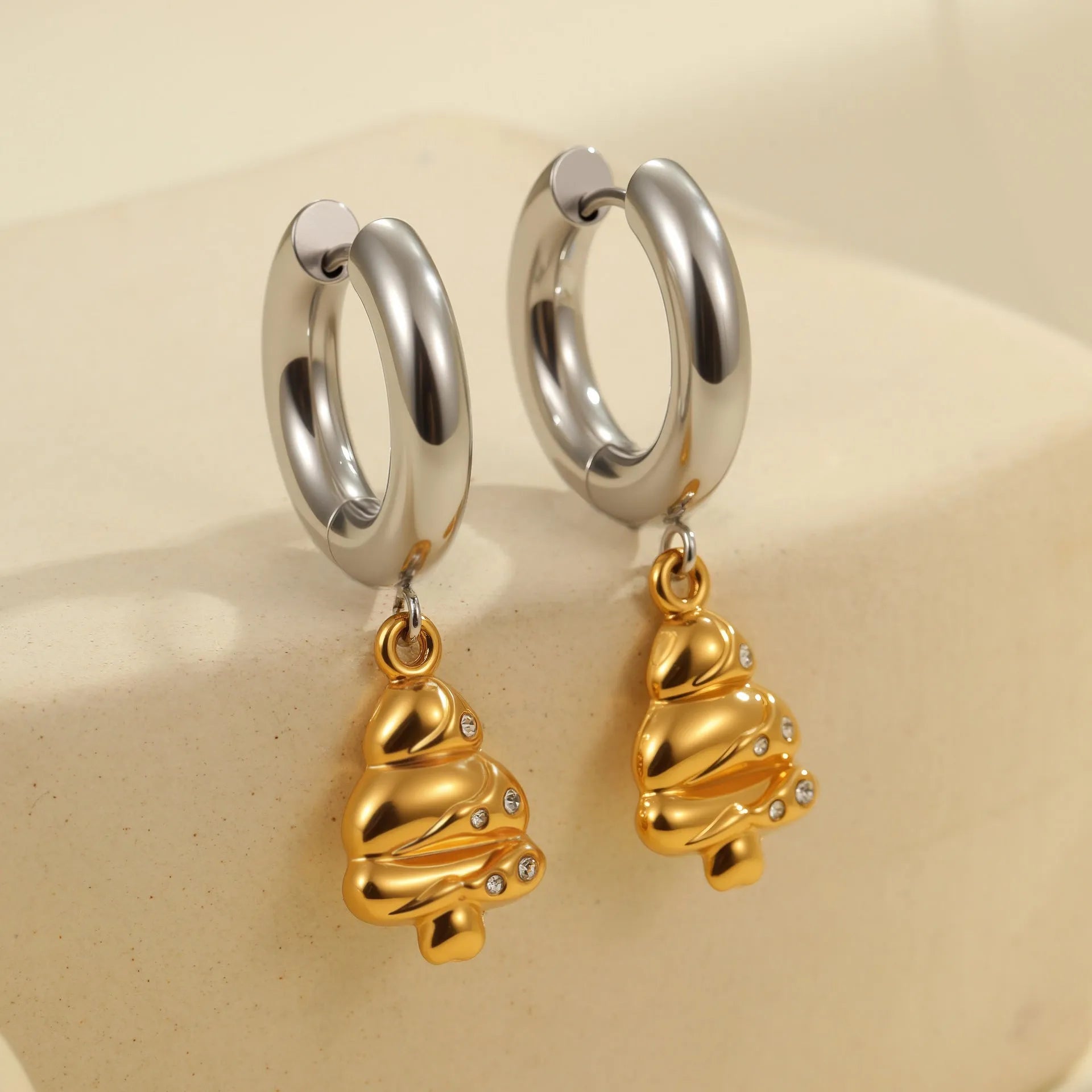 Pair of 18K gold plated stainless steel earrings featuring a Christmas tree design shaped into a heart.