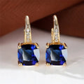 Square geometric moissanite ear clip in gold electroplated finish on copper.
