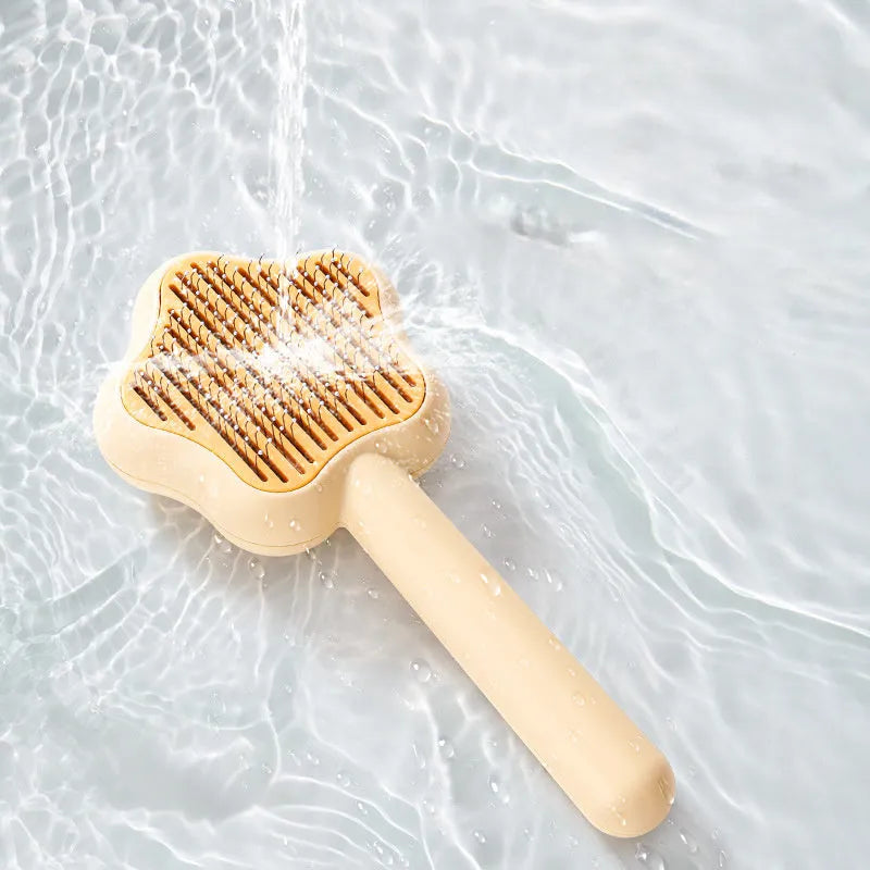 Green stainless steel cat grooming comb with self-cleaning mechanism and four rows of needles