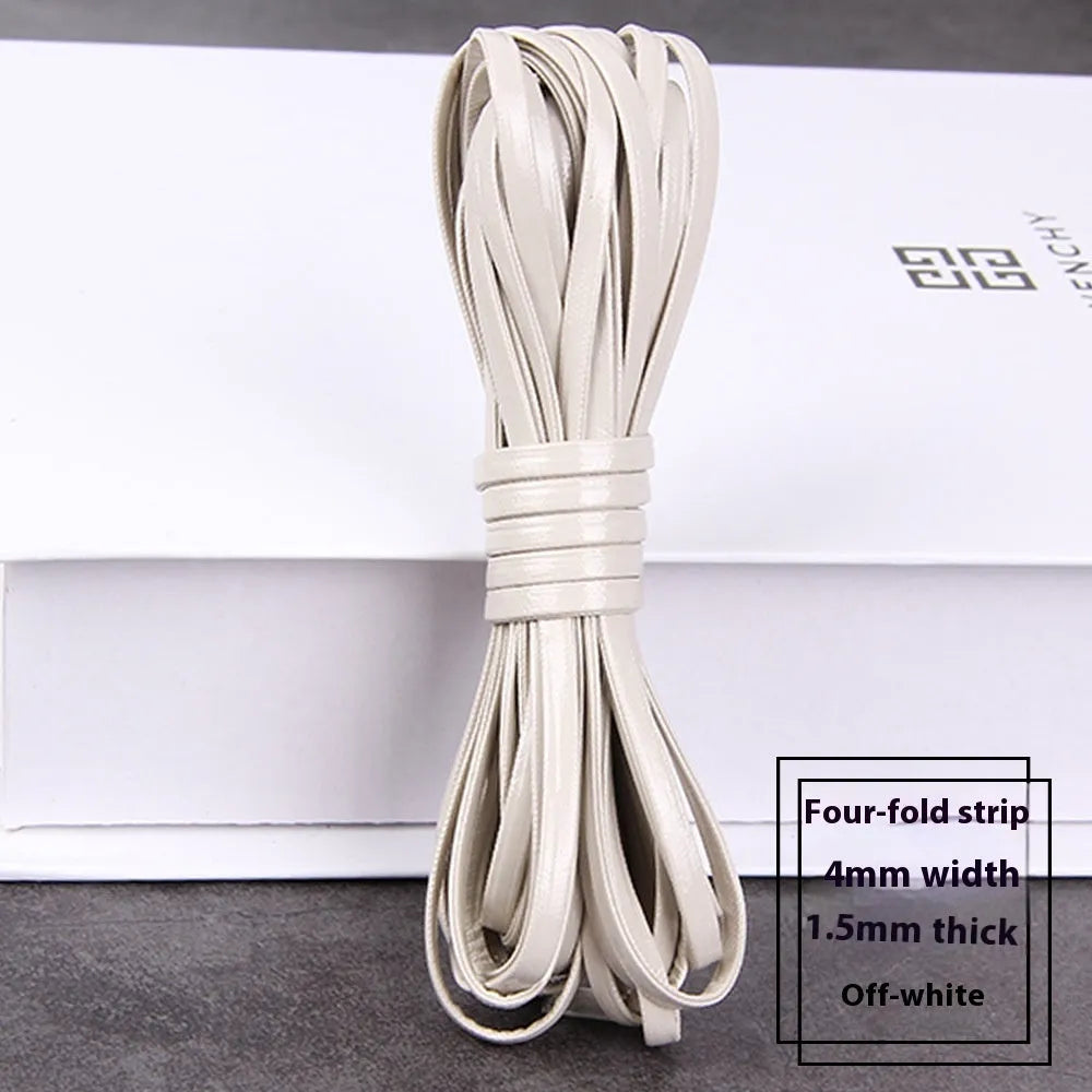 Coils of soft black, brown, and blue woven PU leather craft cord in different thicknesses.