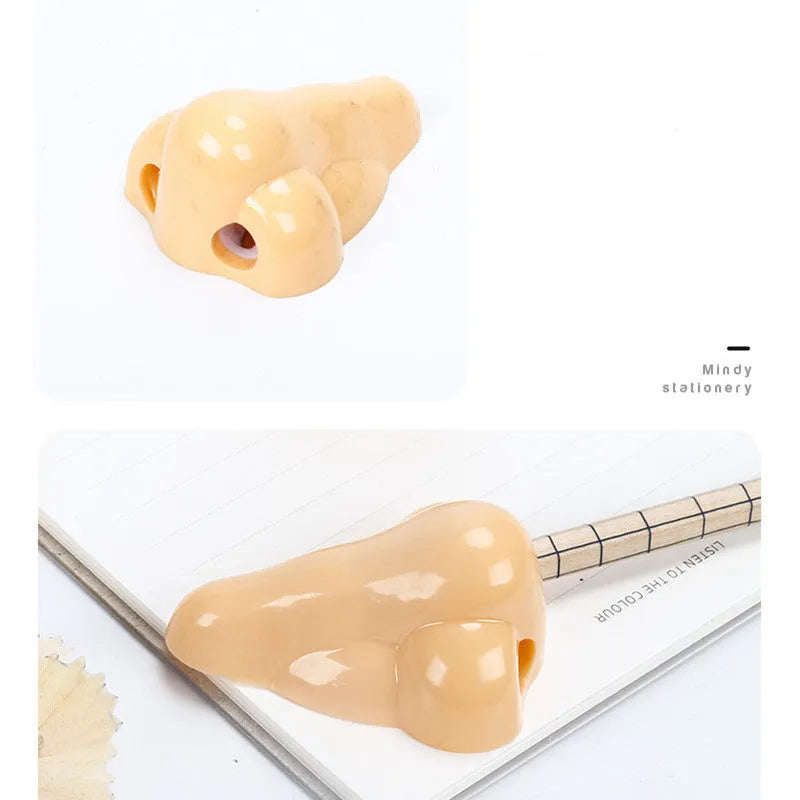 Flesh colour plastic pencil sharpener showing geometry shape and big nostril opening
