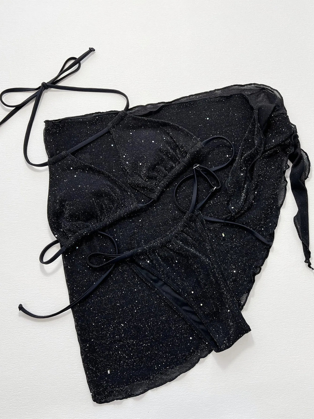 Black three-piece bikini swimsuit set with sports bra top and matching shorts