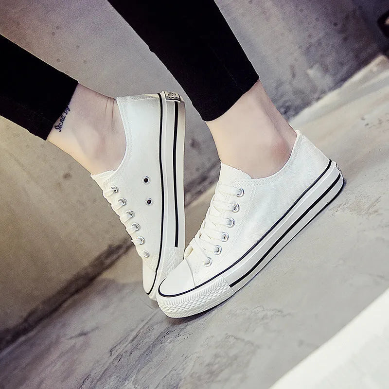 Women's casual canvas shoes in solid colours showing black, white black, white red, and all black options
