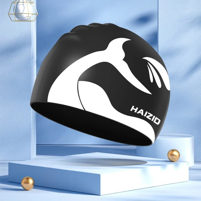 Silicone swim cap with whale tail pattern and waterproof ear protectors in four colour options.