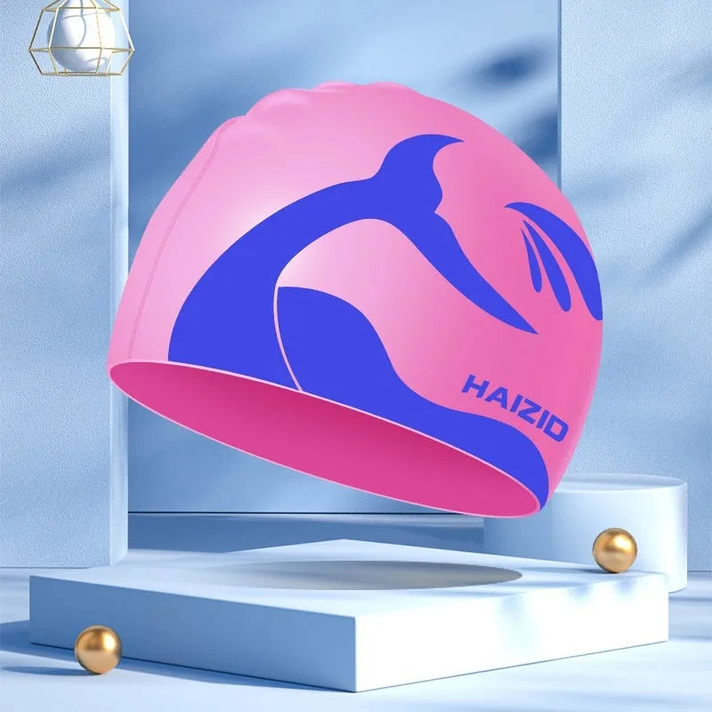 Silicone swim cap with whale tail pattern and waterproof ear protectors in four colour options.