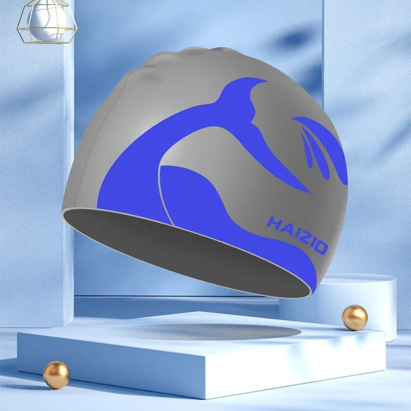 Silicone swim cap with whale tail pattern and waterproof ear protectors in four colour options.