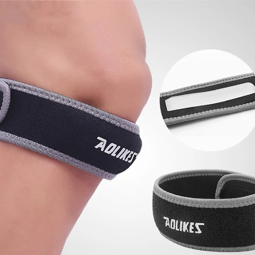 Black and grey patellar retinaculum knee brace for sports