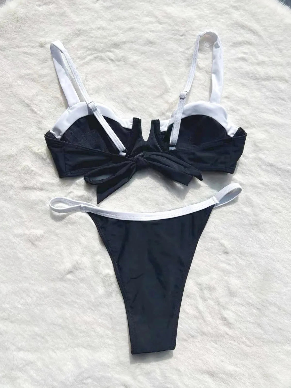 Women's low waist black bikini swimsuit with stitching split detail and briefs style.