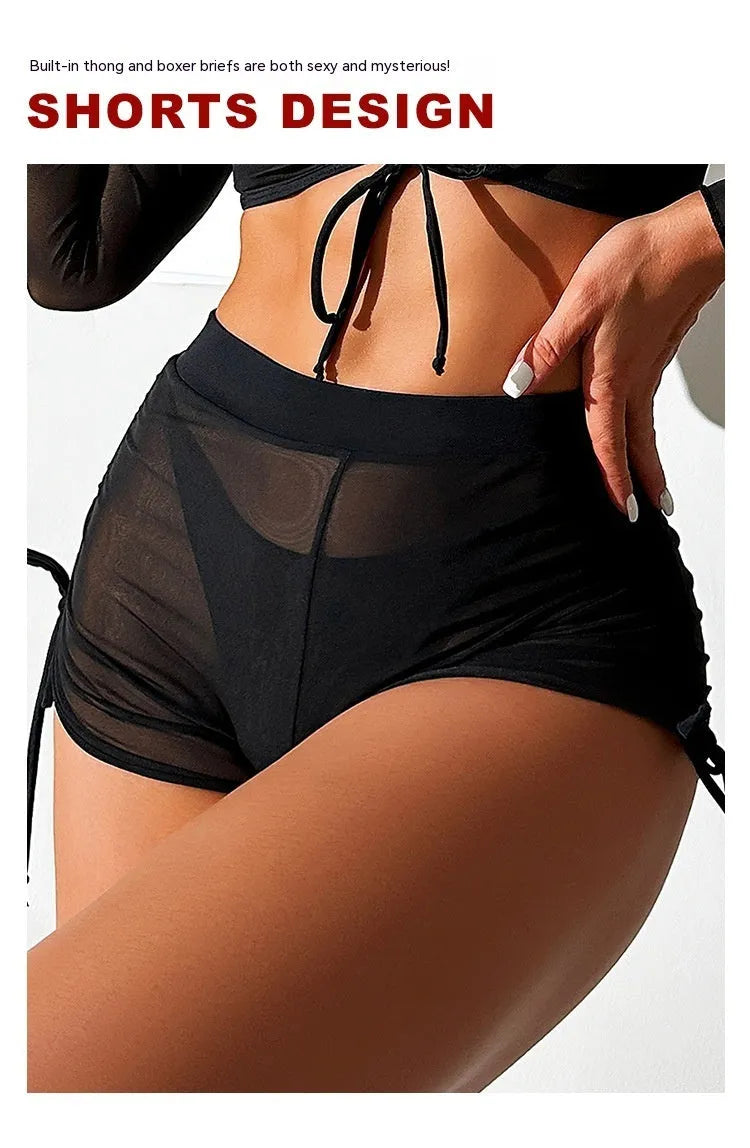 Black mesh four-piece bikini set for women with long sleeves and briefs, laid flat.